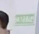The green sign identifying a five-axis machining center